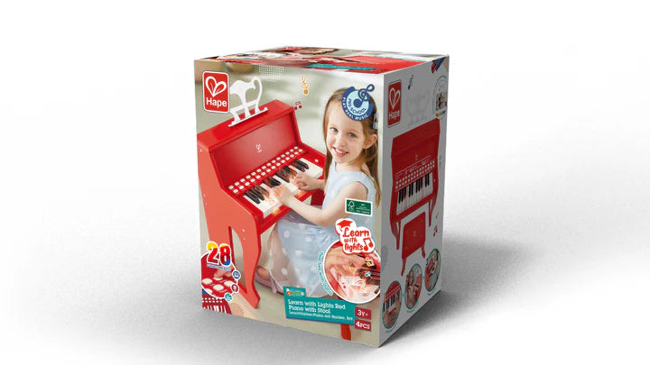 Piano rojo con taburete Hape