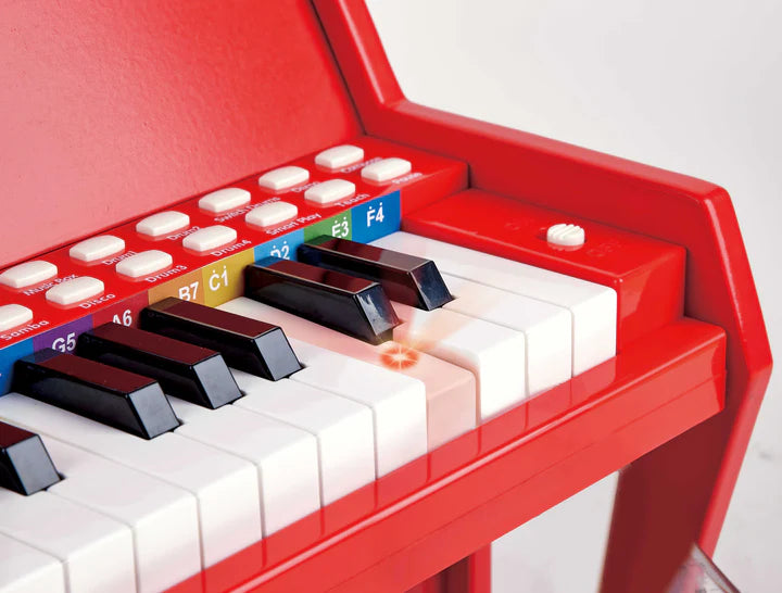 Piano rojo con taburete Hape