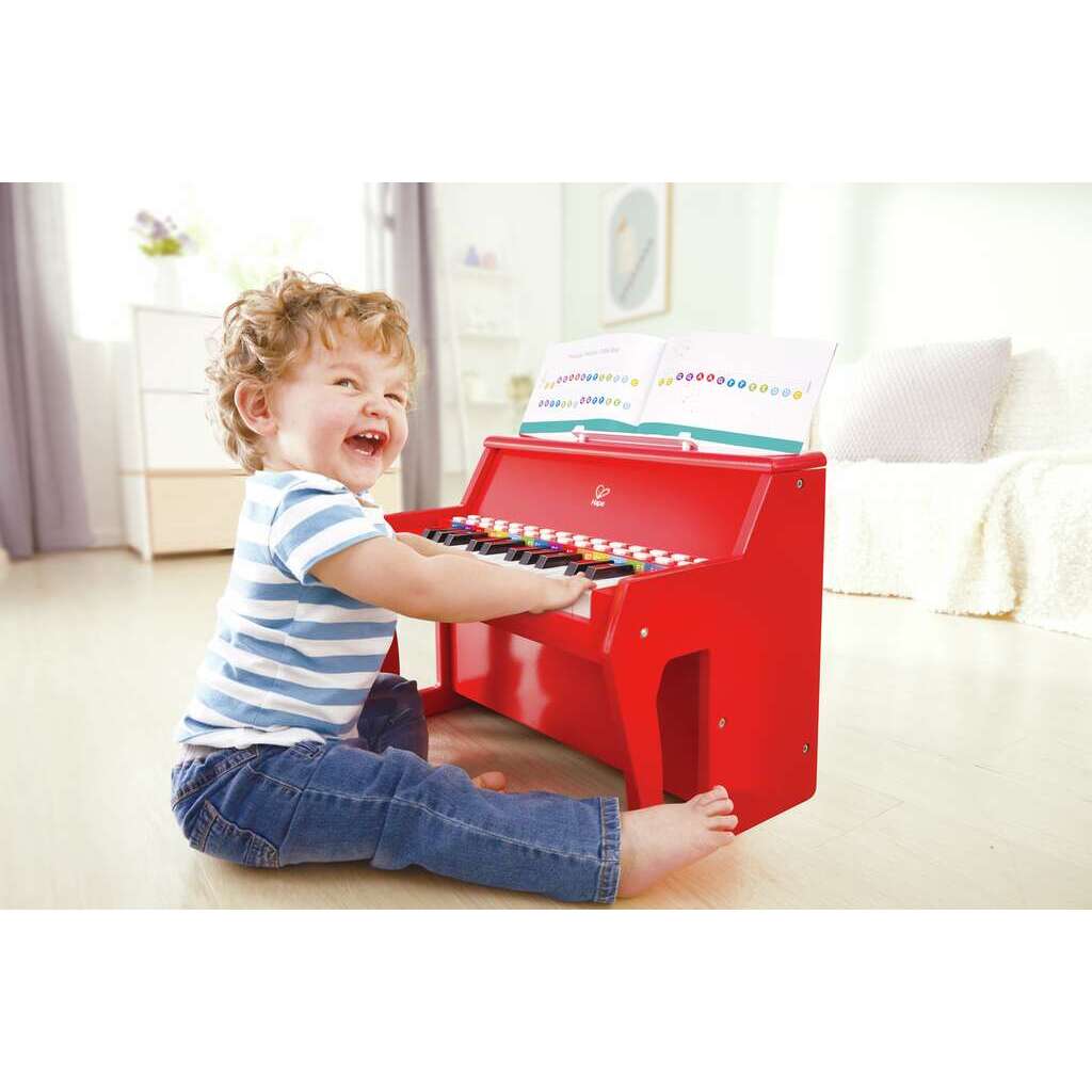 Piano rojo con taburete Hape